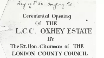 Label from ceremony when keys to first house were handed over