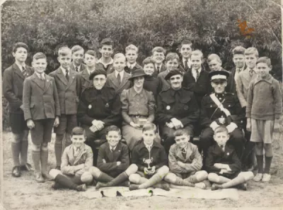 Taken after 1941, a group of boys seems to have won something.