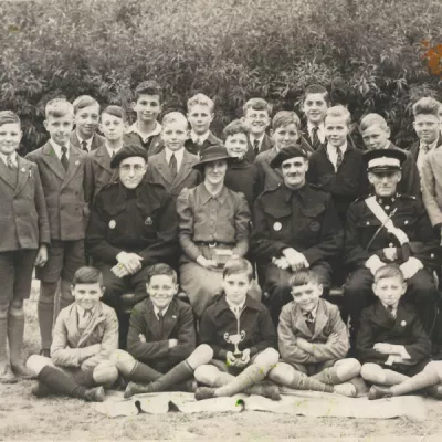 Taken after 1941, a group of boys seems to have won something.