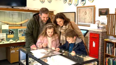 Family exploring local history exhibit 2