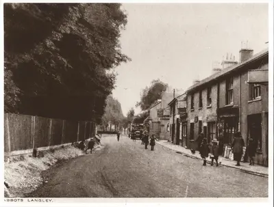 Abbots Langley showing shops old bus pub people in street